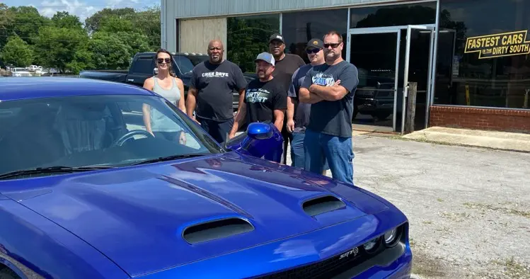 A picture of Eric Malone with one of their rides